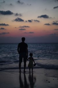 Father and daughter on beach